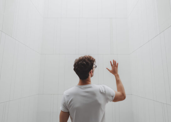 Man in a minimal white interior smart home